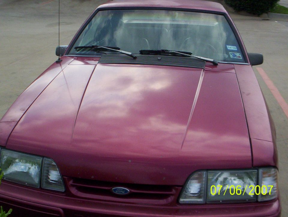 Maroon Fox-body Ford Mustang front hood and headlights dated 2007