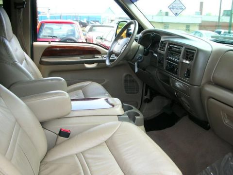 2000 Ford Excursion - Interior view of a 2000 Ford Excursion, showing the tan leather seats, dashboard, and center console.
