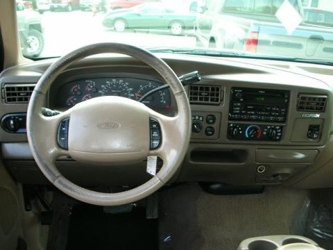 2000 Ford Excursion - Interior view of a Ford Excursion dashboard, showing the steering wheel, instrument cluster, and center console.