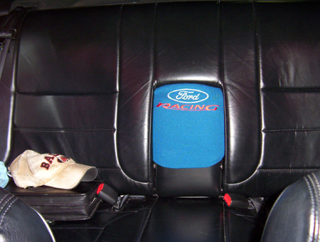 1993 Ford Taurus - Interior view of car seats with Ford Racing branding and a baseball cap.