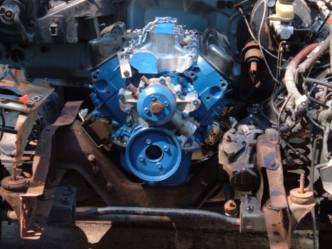 1990 Ford Ranger - Engine bay of a vehicle undergoing modification, showing a freshly painted V8 engine.