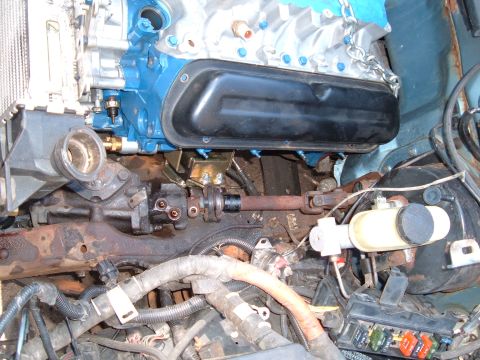 1990 Ford Ranger - Close-up view of engine and steering system components, with visible rust on the frame.