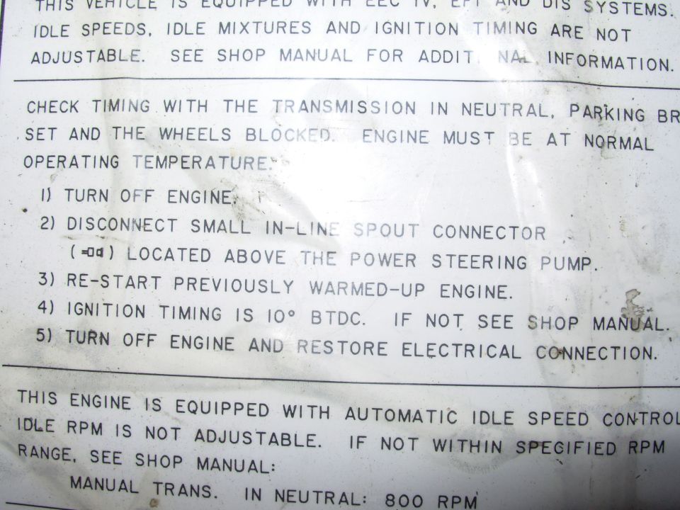 EEC-IV engine decal with ignition timing check steps, 10° BTDC spec and idle speed notes