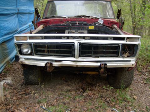 1976 Ford F-100 - The grille on this Ford truck has the word "FORD" spelled out across it. The truck appears to be a 1973 model.