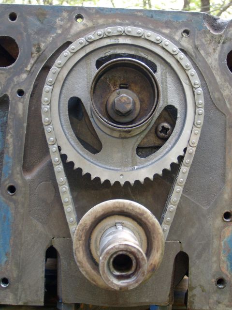 1976 Ford F-100 - Engine block with timing chain and gears visible, part of an engine rebuild or swap.