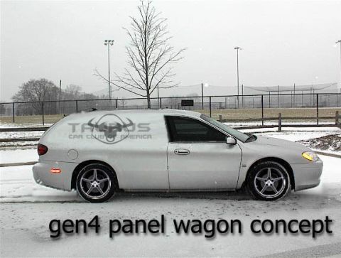 1993 Ford Taurus - A silver panel wagon concept car is shown in a snowy environment, outdoor setting with a fence and trees in the background.