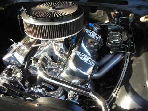 1998 Ford Crown Victoria - A highly polished V8 engine is shown with custom chrome components and an aftermarket air intake system.