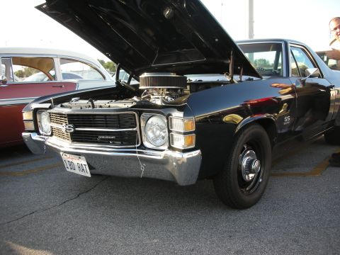 1998 Ford Crown Victoria - This black 1972 Chevrolet El Camino SS is displayed with its hood open, revealing the engine and a custom California license plate.
