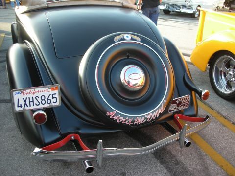 1998 Ford Crown Victoria - Rear view of a classic convertible showing a spare tire and California license plate.