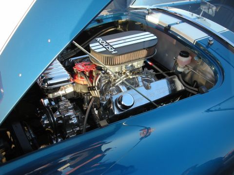 1998 Ford Crown Victoria - Engine bay details of a blue car, Roush branded components.