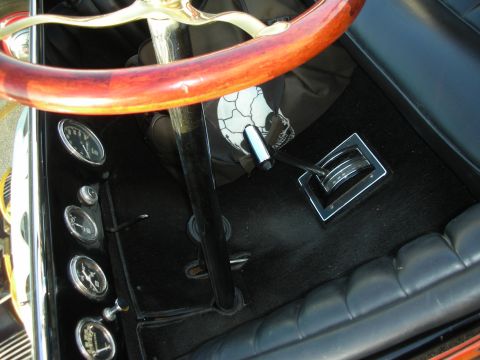 1998 Ford Crown Victoria - Interior view of a car's dashboard, steering wheel, and shifter mechanism.