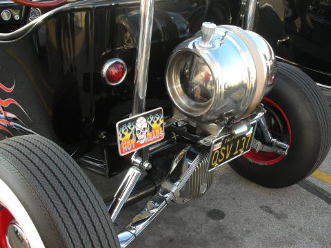 1998 Ford Crown Victoria - This custom hot rod features flame decals, a prominent chrome fuel tank, and a 'Hot Heads' license plate.