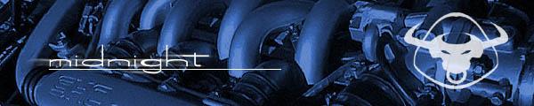 Close-up of engine components with the word 'midnight' and a bull logo
