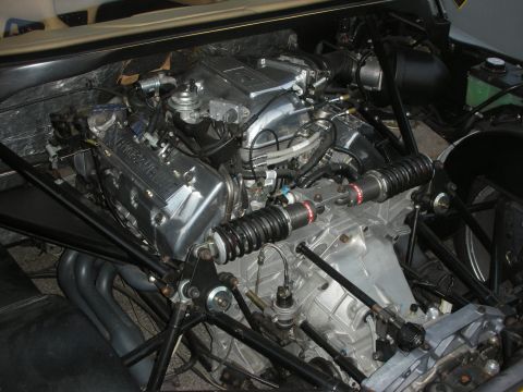 1998 Ford Crown Victoria - Close-up view of a V8 engine, its intricate mechanical components and polished metal surfaces.