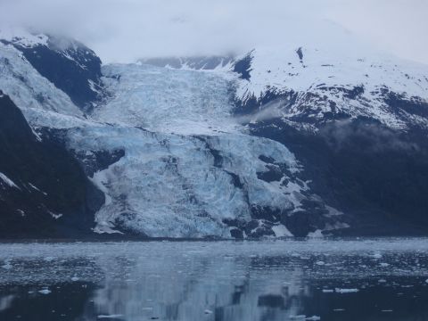 1973 Ford Ranchero - Expansive glacier meeting the ocean, surrounded by misty, snow-covered peaks.