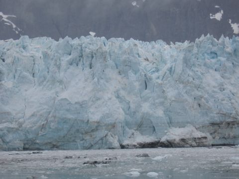 1973 Ford Ranchero - A massive glacier face looms over a body of water filled with icebergs.