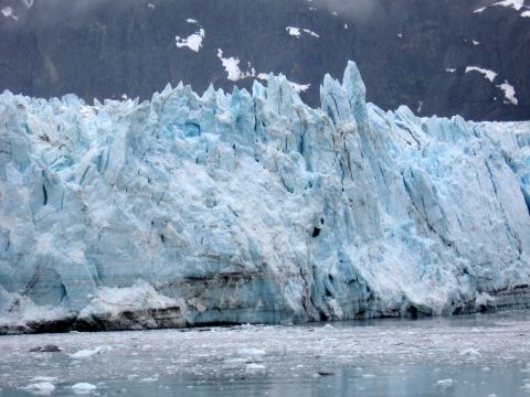 1973 Ford Ranchero - A massive glacier face with sharp ice formations towers over floating ice chunks in the water.