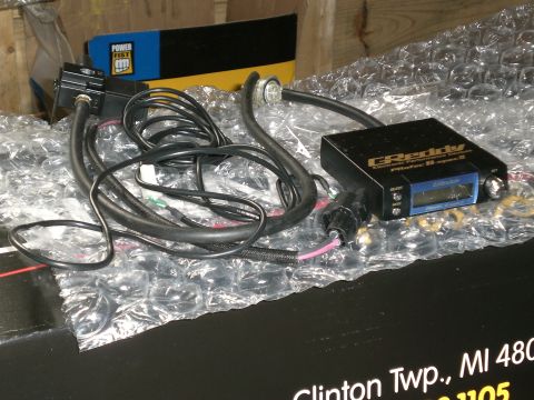 1995 Ford Probe - A Greddy Electronic Performance Controller, also known as a boost controller, is shown with its wiring harness and a Power Fist box in the…