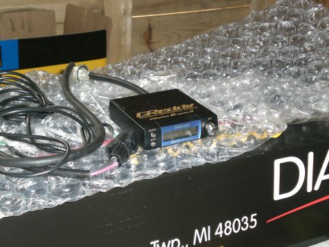 1995 Ford Probe - GReddy electronic boost controller part with visible text and wiring.
