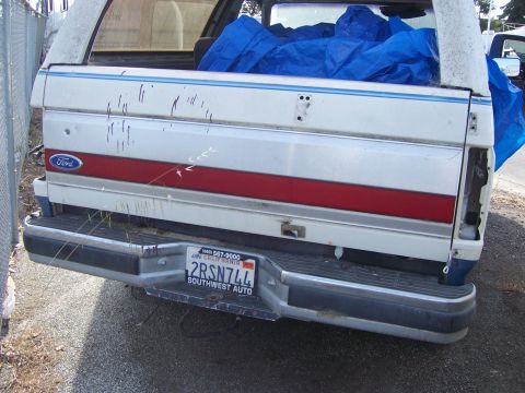 1991 Ford Bronco - Rear view of a 1991 Ford Bronco, showing the Ford badge and a California license plate.