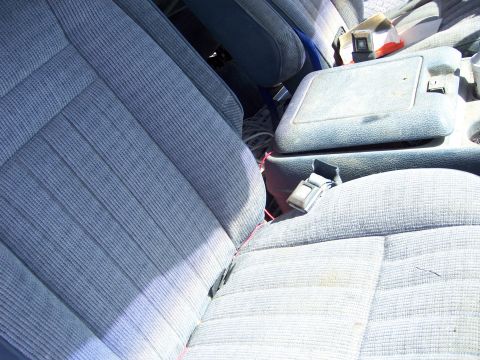 1991 Ford Bronco - Interior view of a vehicle's front seats and center console.