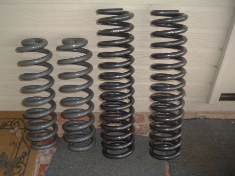 1986 Ford Bronco - new superflex 4" springs next to old ttb 4" tuff country springs