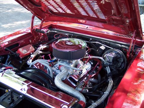 1972 Ford Ranchero - Engine bay of a red vehicle, showing a chrome air filter and MSD ignition box.