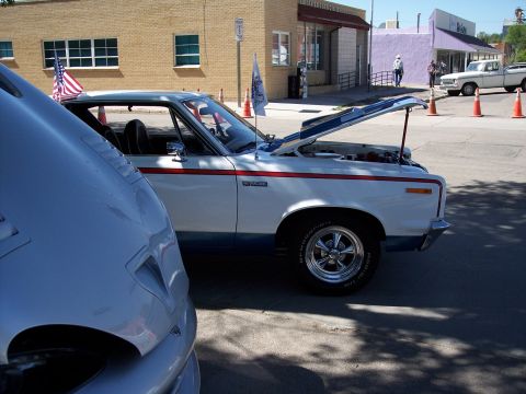 1972 Ford Ranchero - A 1972 Ford Ranchero is displayed with its hood open at a car show.
