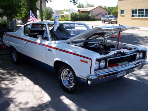 1972 Ford Ranchero - AMC Hornet from the early 1970s, hood up at a car show.