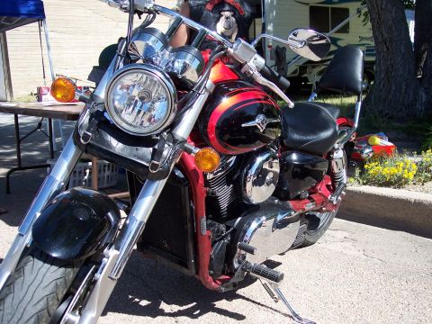 1972 Ford Ranchero - Close-up of a motorcycle's front end, showing the headlight, handlebars, and part of the fuel tank.