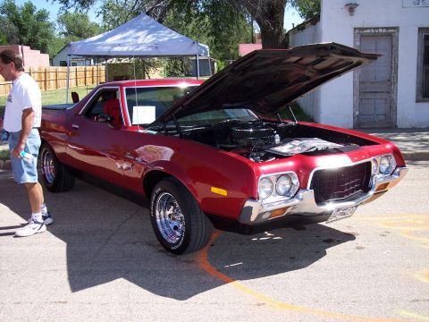1972 Ford Ranchero - Red 1972 Ford Ranchero displayed at a car show with its hood open.