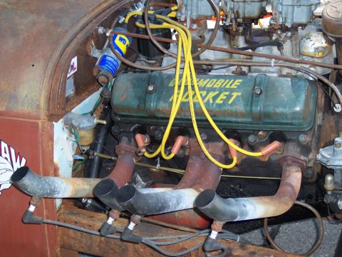 1972 Ford Ranchero - Close-up of an Oldsmobile Rocket engine, showing its dual carburetors and custom exhaust.