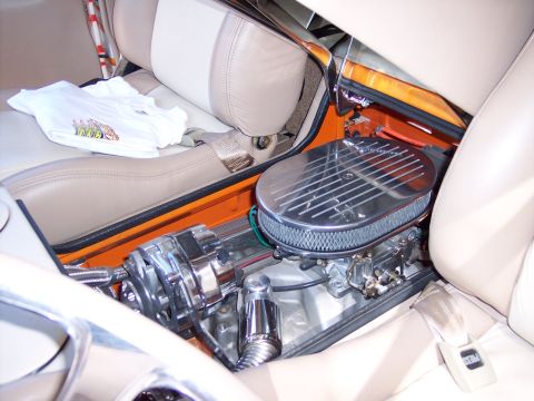 1972 Ford Ranchero - A white t-shirt rests on the passenger seat of a car, next to the engine compartment.