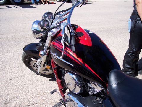 1972 Ford Ranchero - Close-up of a motorcycle's front end, showing the handlebars, fuel tank, and part of the seat.