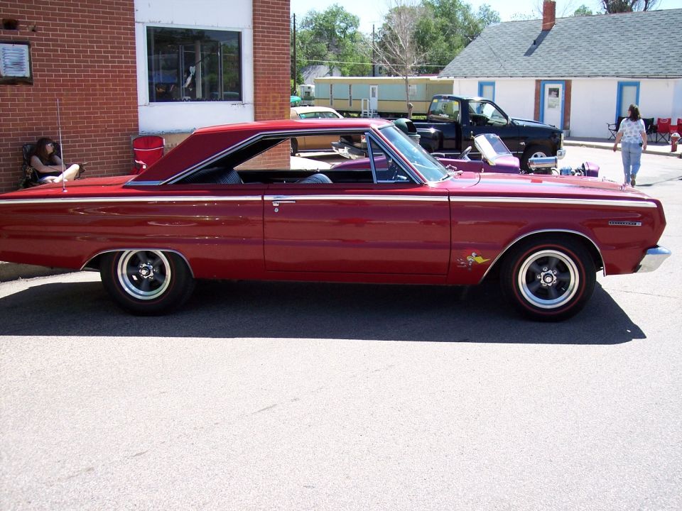 Red 1965 coupe utility vehicle side view