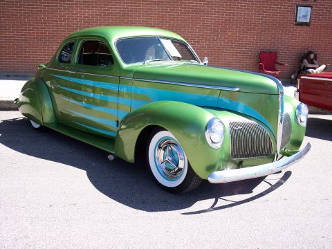 1972 Ford Ranchero - Customized 1940 Plymouth coupe with a two-tone green and blue paint scheme sits parked outdoors.