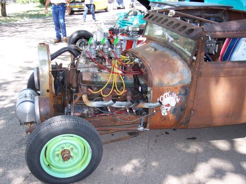 1972 Ford Ranchero - A heavily customized hot rod with its engine exposed, parked at an outdoor event.