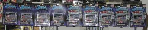 1981 Ford Bronco - Multiple boxed model vehicles are displayed on a shelf, with some packaging showing graphics of cars and trucks.