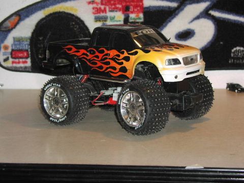 1981 Ford Bronco - This remote control truck has flame decals and large off-road tires.