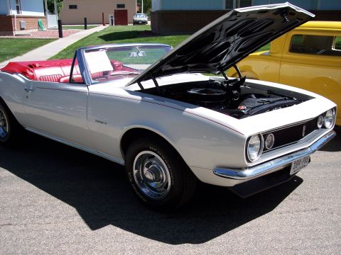 1972 Ford Ranchero - White 1967 Chevrolet Camaro convertible with red interior, hood open, parked next to a yellow car.