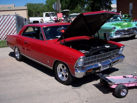 1972 Ford Ranchero - 1967 Chevrolet Nova SS coupe at a car show, with another classic car visible in the background.