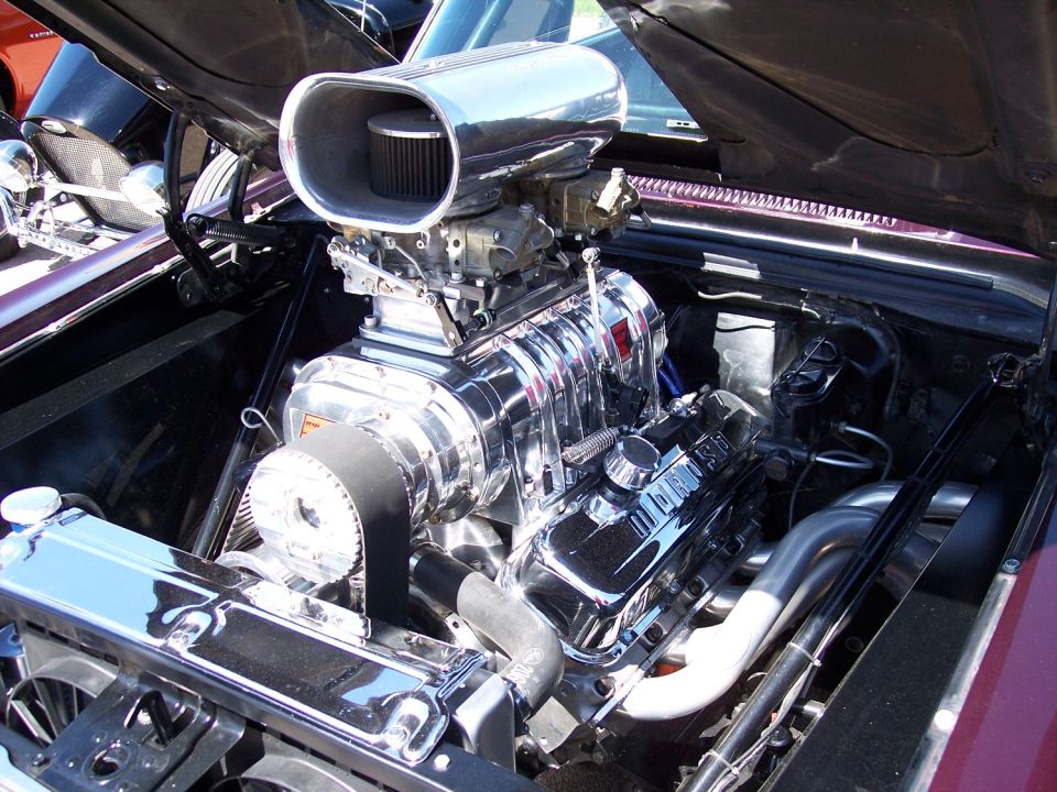 Engine with a chrome supercharger and air intake, viewed from the front