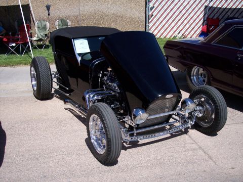 1972 Ford Ranchero - A custom hot rod is displayed with its hood open, revealing the engine compartment.
