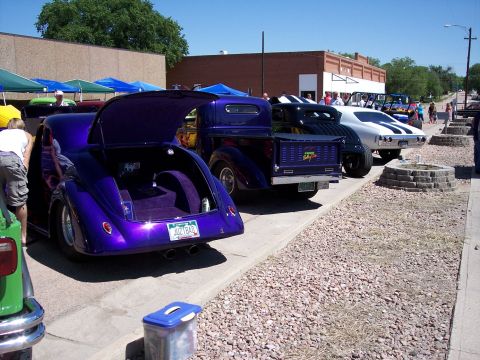 1972 Ford Ranchero - Custom hot rod pickup truck on display at a car show, parked alongside other modified vehicles.