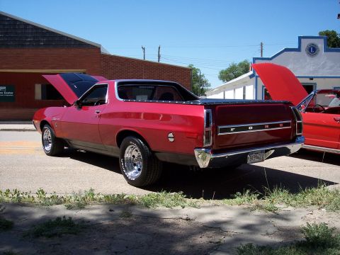 1972 Ford Ranchero - A red 1972 Ford Ranchero is parked on the street with its hood open, alongside another vehicle.