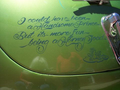 1972 Ford Ranchero - A car's fender displays a humorous quote about being a horny toad instead of a prince, accompanied by a frog graphic.