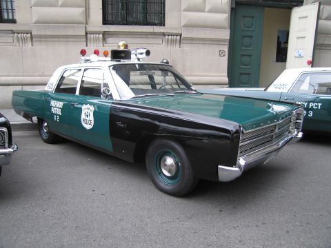 1991 Ford LTD Crown Victoria - vintage green-and-black police sedan lettered 'HIGHWAY PATROL #2' with a roof light bar parked along a city street.
