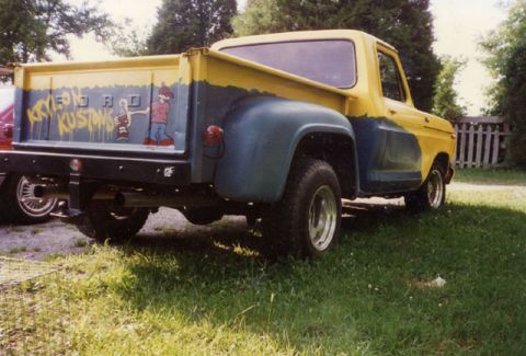 1981 Ford Bronco - This pickup truck features a two-tone paint job and custom artwork on its bed.