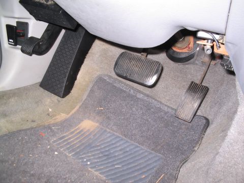 2001 Ford Crown Victoria - Mazda RX-8 deadpedal installed. braced it against the kickpanel and drilled two holes for mounting. Works GREAT.