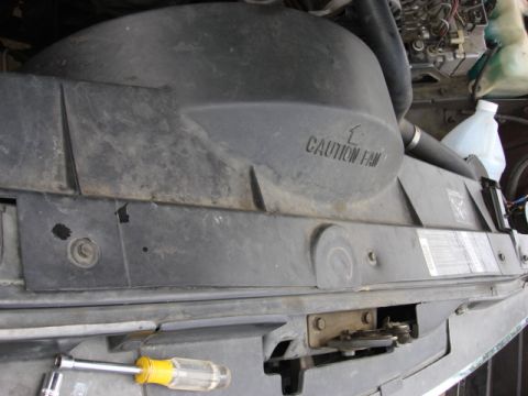1983 Ford Bronco - there are 3 10mm screw on the top of the fan shroud. i removed them.